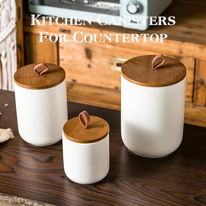 JOJUNO White Ceramic Canister Set with Wooden Lid, 3-Piece Airtight Food Storage Jars for Kitchen Counter - Flour, Sugar, Coffee, Tea, Spice - Small, Medium, Large Sizes